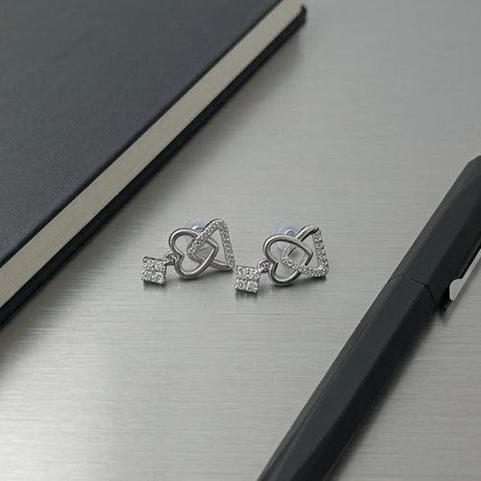 DIVYORO INTERLOCKING HEART AND KEY SILVER STUDS EARRING