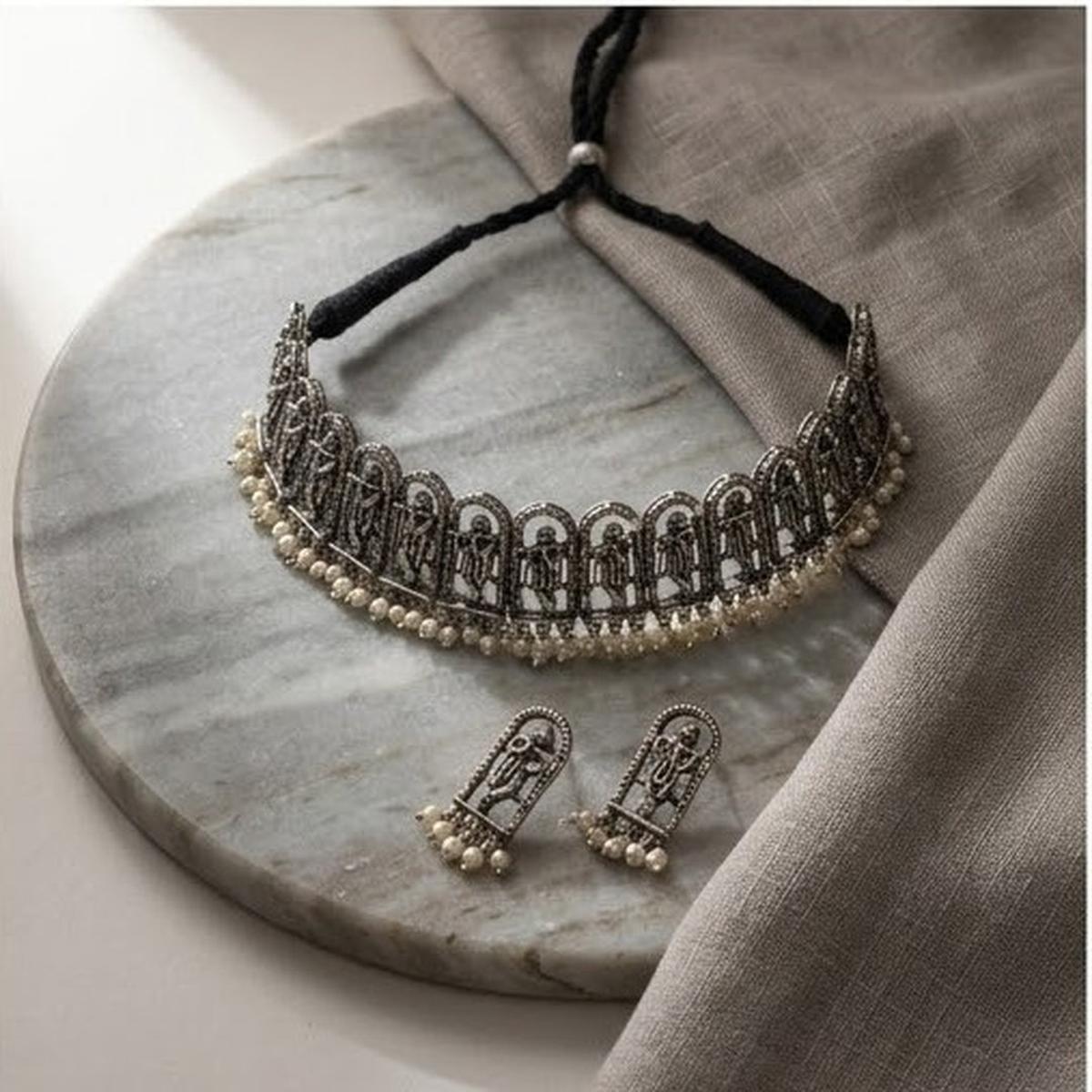 DIVYORO INTRICATE OXIDIZED SILVER KRISHNA MOTIF CHOKER SET