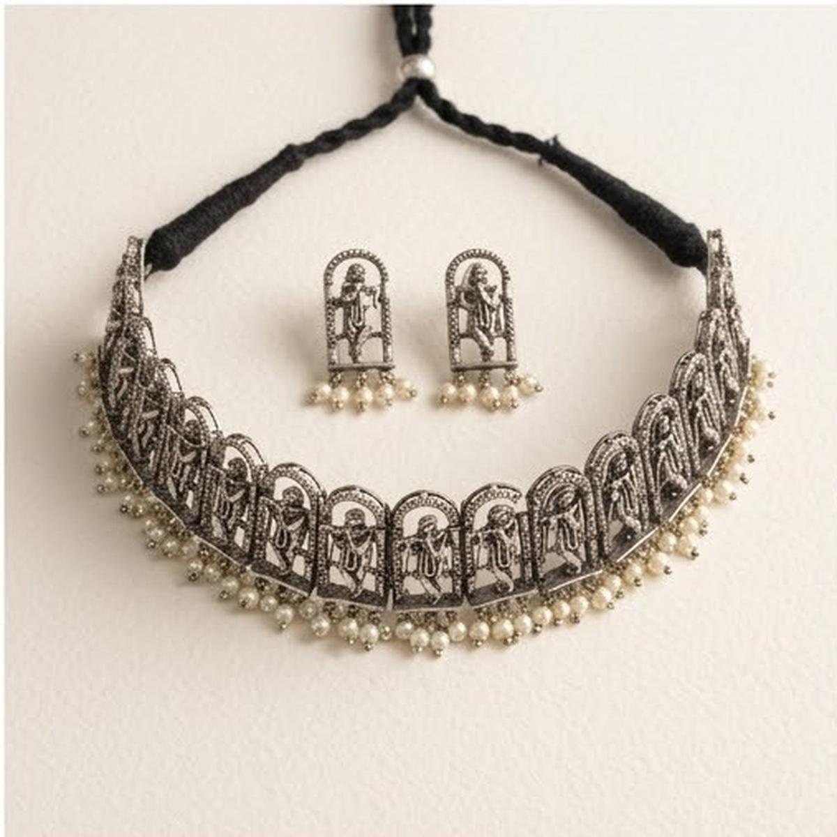 DIVYORO INTRICATE OXIDIZED SILVER KRISHNA MOTIF CHOKER SET