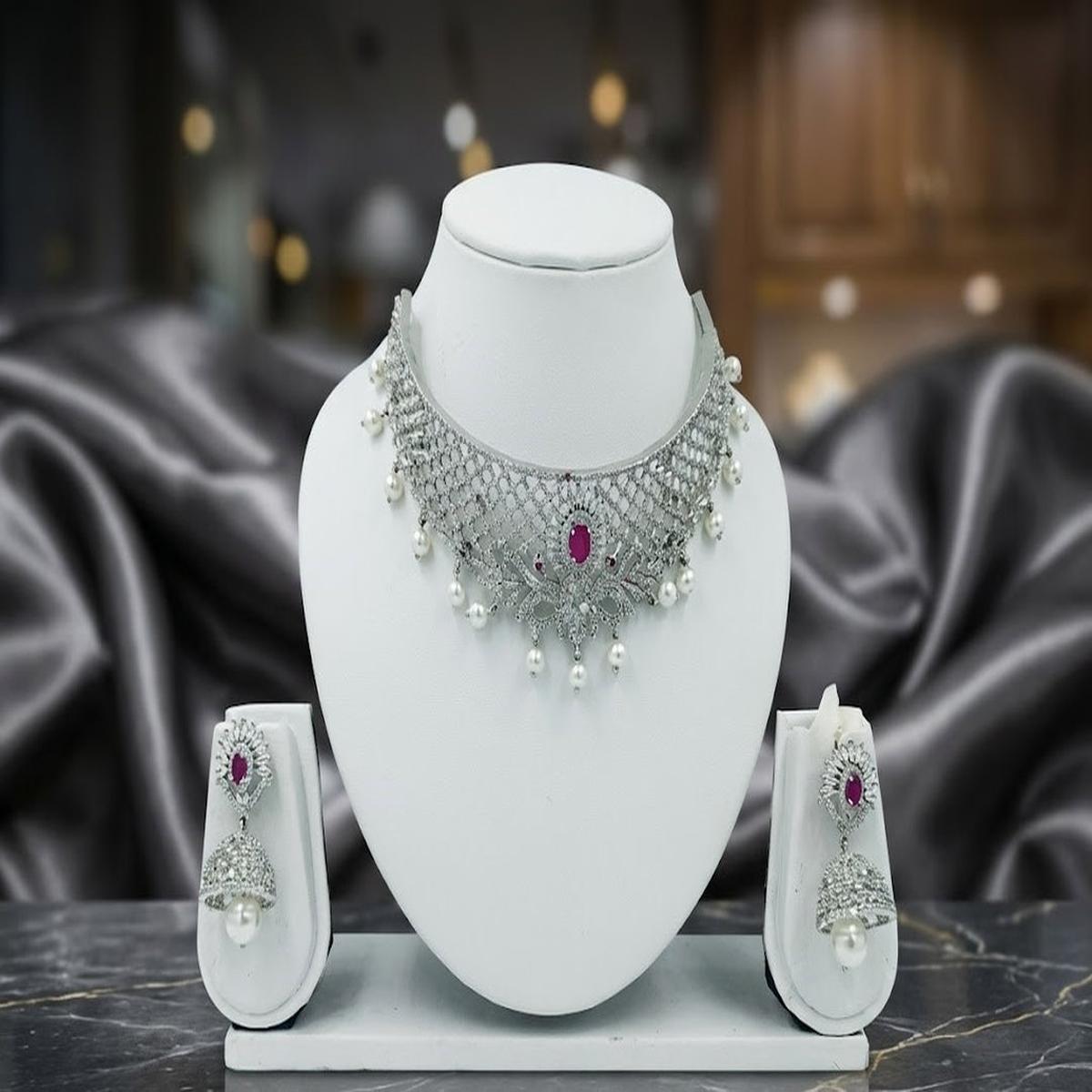 DIVYORO ELEGANT SILVER-TONED KUNDAN CHOKER SET WITH PEARL DROPS AND RUBY ACCENTS