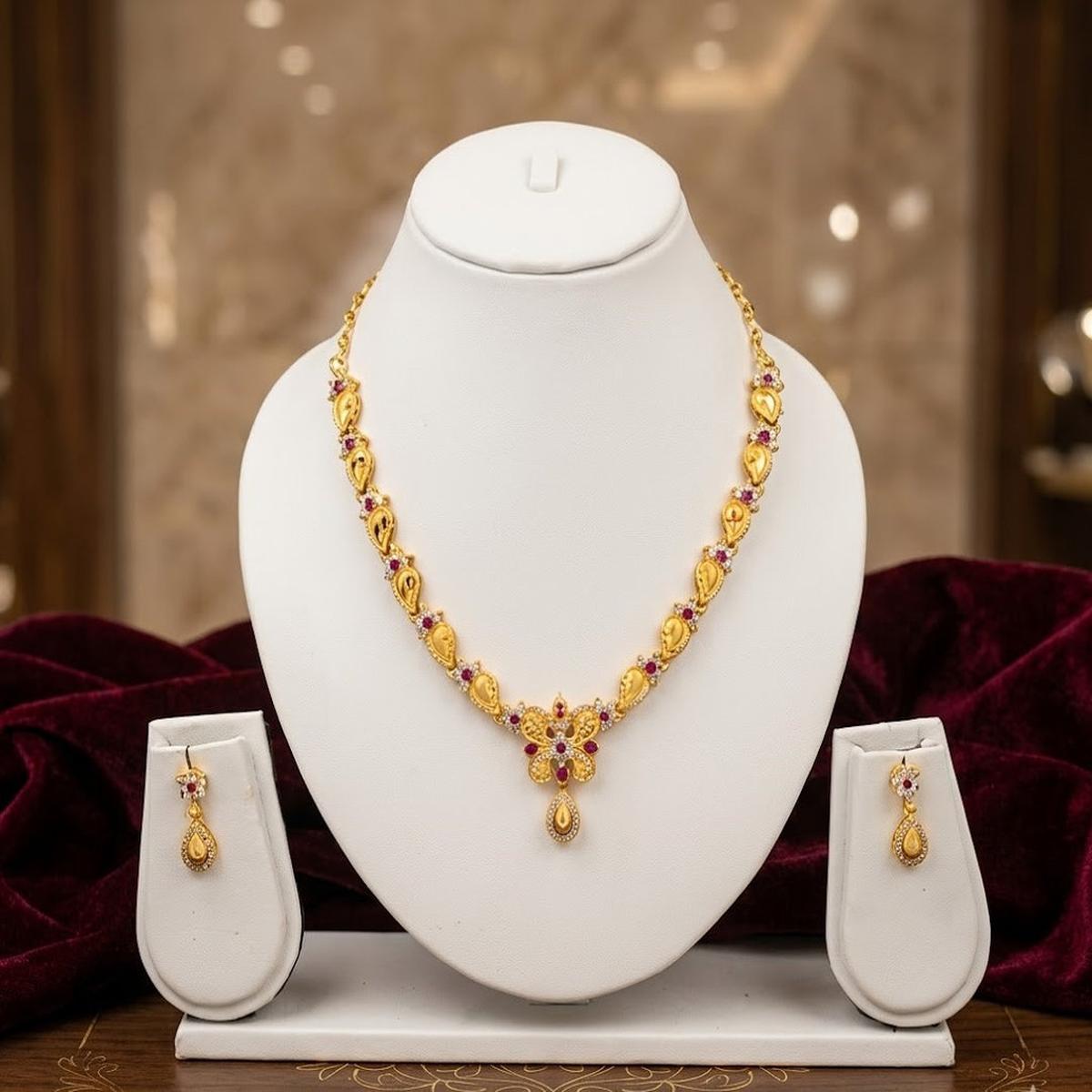 DIVYORO GOLD-PLATED BUTTERFLY MOTIF NECKLACE SET WITH RUBY ACCENTS