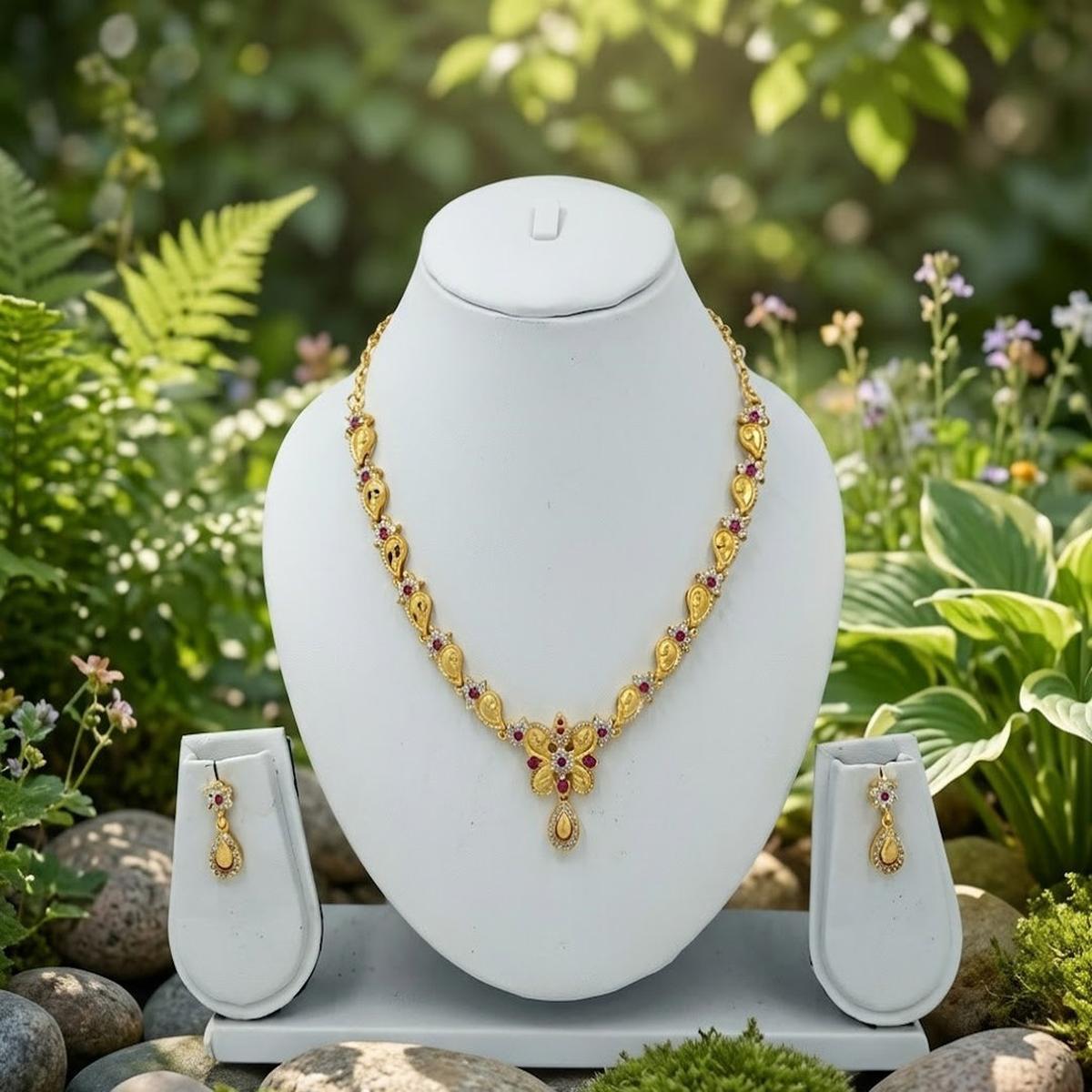 DIVYORO GOLD-PLATED BUTTERFLY MOTIF NECKLACE SET WITH RUBY ACCENTS