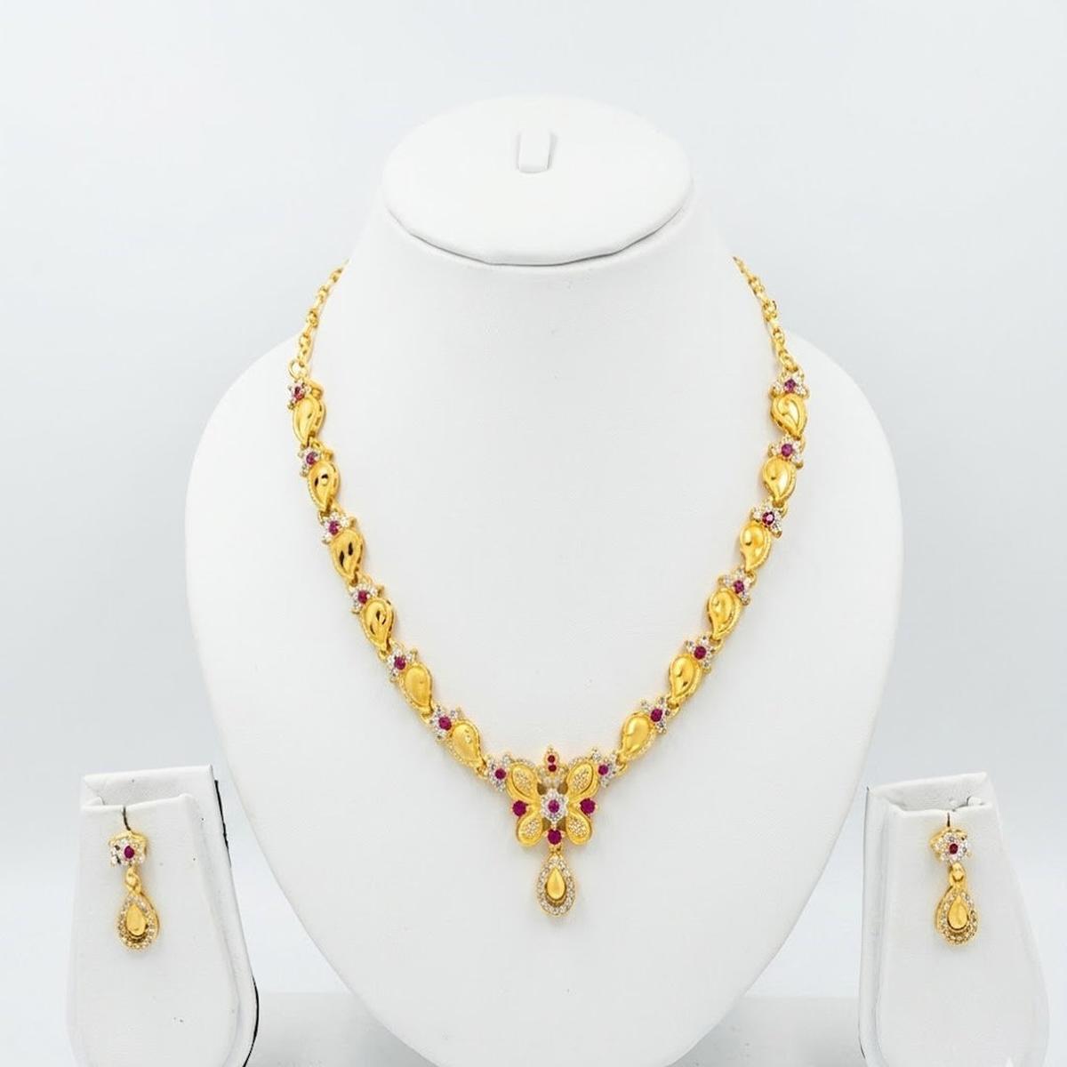 DIVYORO GOLD-PLATED BUTTERFLY MOTIF NECKLACE SET WITH RUBY ACCENTS
