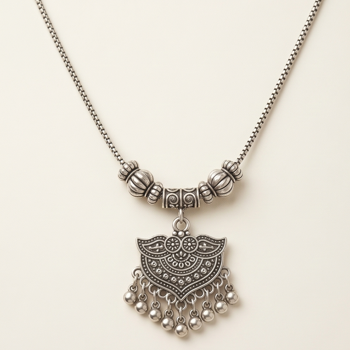 DIVYORO OXIDIZED TEXTURED GHUNGROO PENDANT