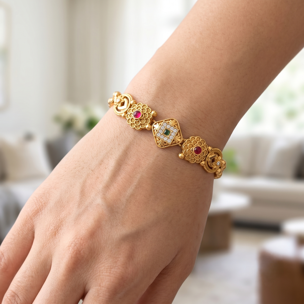 DIVYORO FLORAL MOTIF TRADITIONAL GOLD BRACELET WITH RUBY AND EMERALD ACCENTS