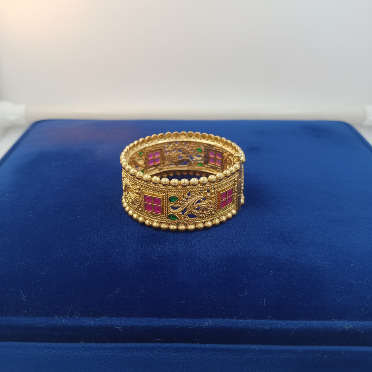 DIVYORO DETAILED ANTIQUE GOLD HINGED BANGLE WITH GEMSTONE AND ENAMEL DETAILING