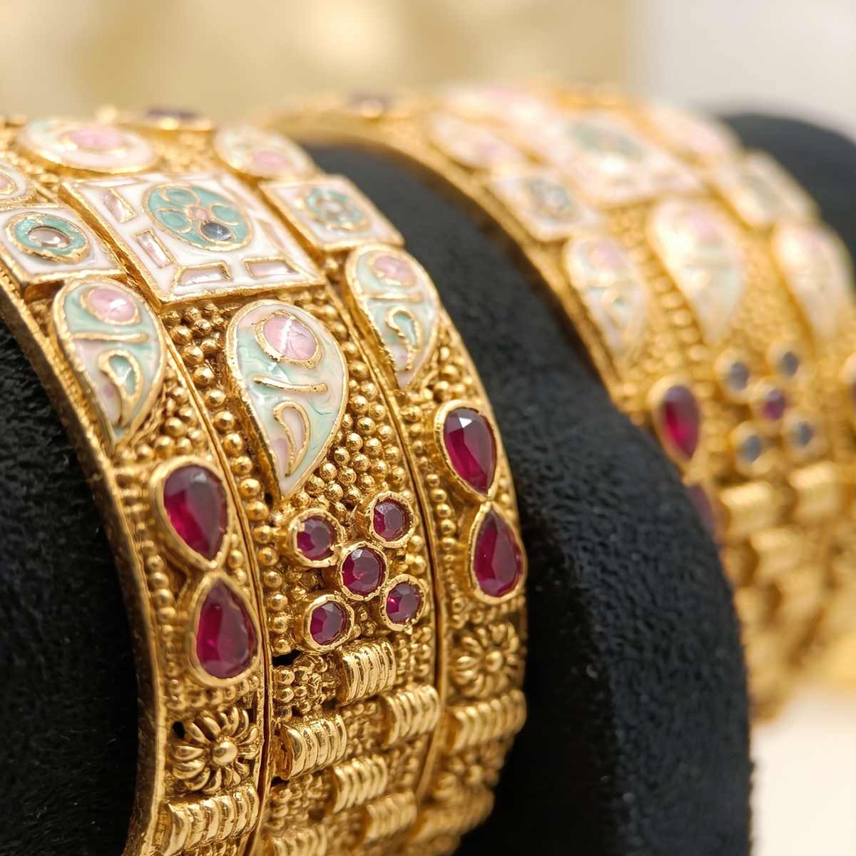 DIVYORO ELABORATE ANTIQUE GOLD BANGLE SET WITH MULTICOLOR ENAMEL AND GEMSTONE ACCENTS
