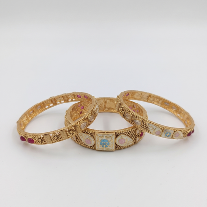 DIVYORO ELABORATE ANTIQUE GOLD BANGLE SET WITH MULTICOLOR ENAMEL AND GEMSTONE ACCENTS