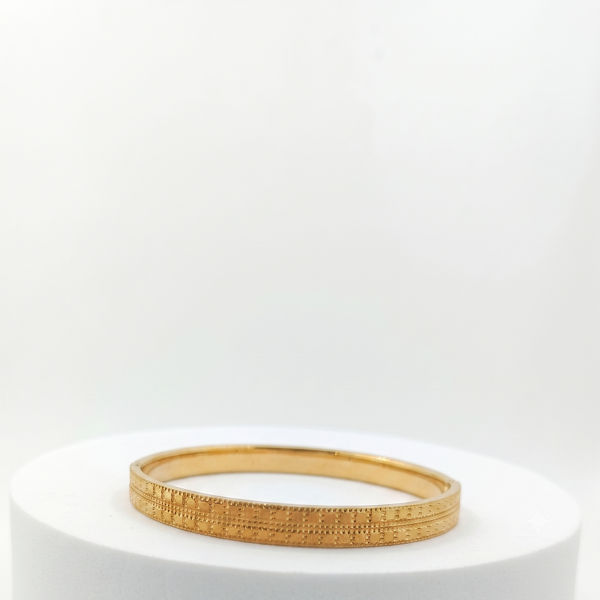 DIVYORO MODERN GOLD KADA WITH REPEATING TEXTURED GRID DETAIL