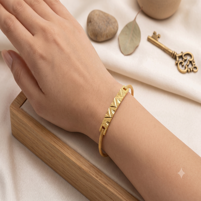 DIVYORO MINIMALIST TEXTURED GOLD KADA WITH GEOMETRIC CENTERPIECE