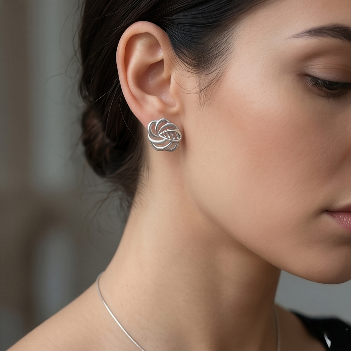 DIVYORO INTERTWINED SILVER STUDS EARRING
