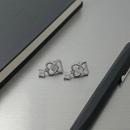 DIVYORO INTERLOCKING HEART AND KEY SILVER STUDS EARRING