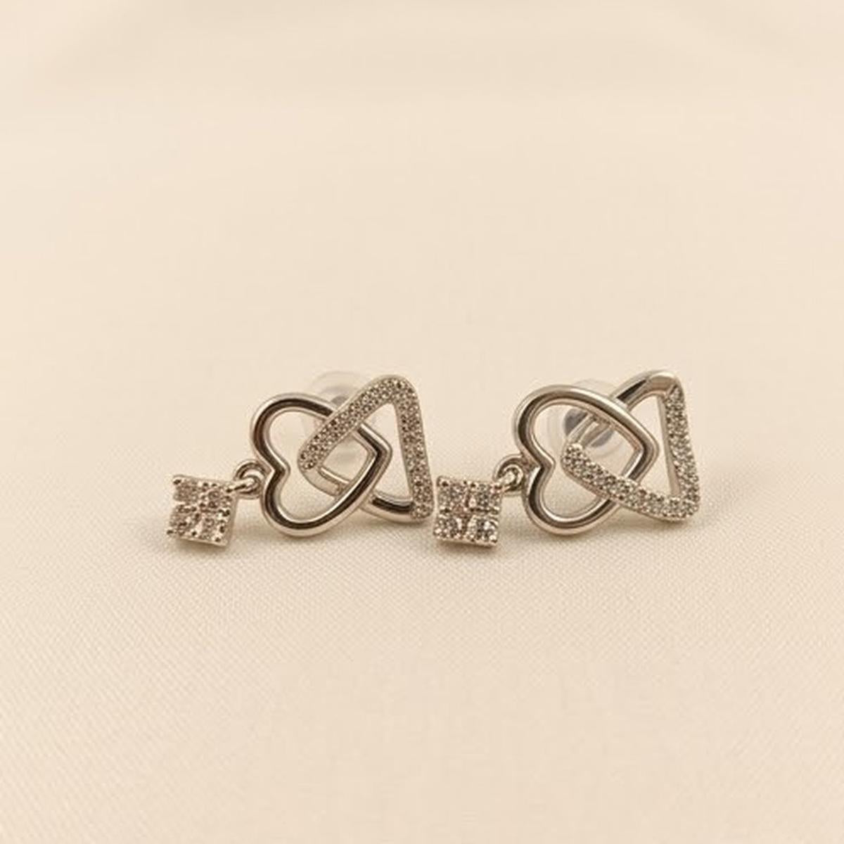 DIVYORO INTERLOCKING HEART AND KEY SILVER STUDS EARRING
