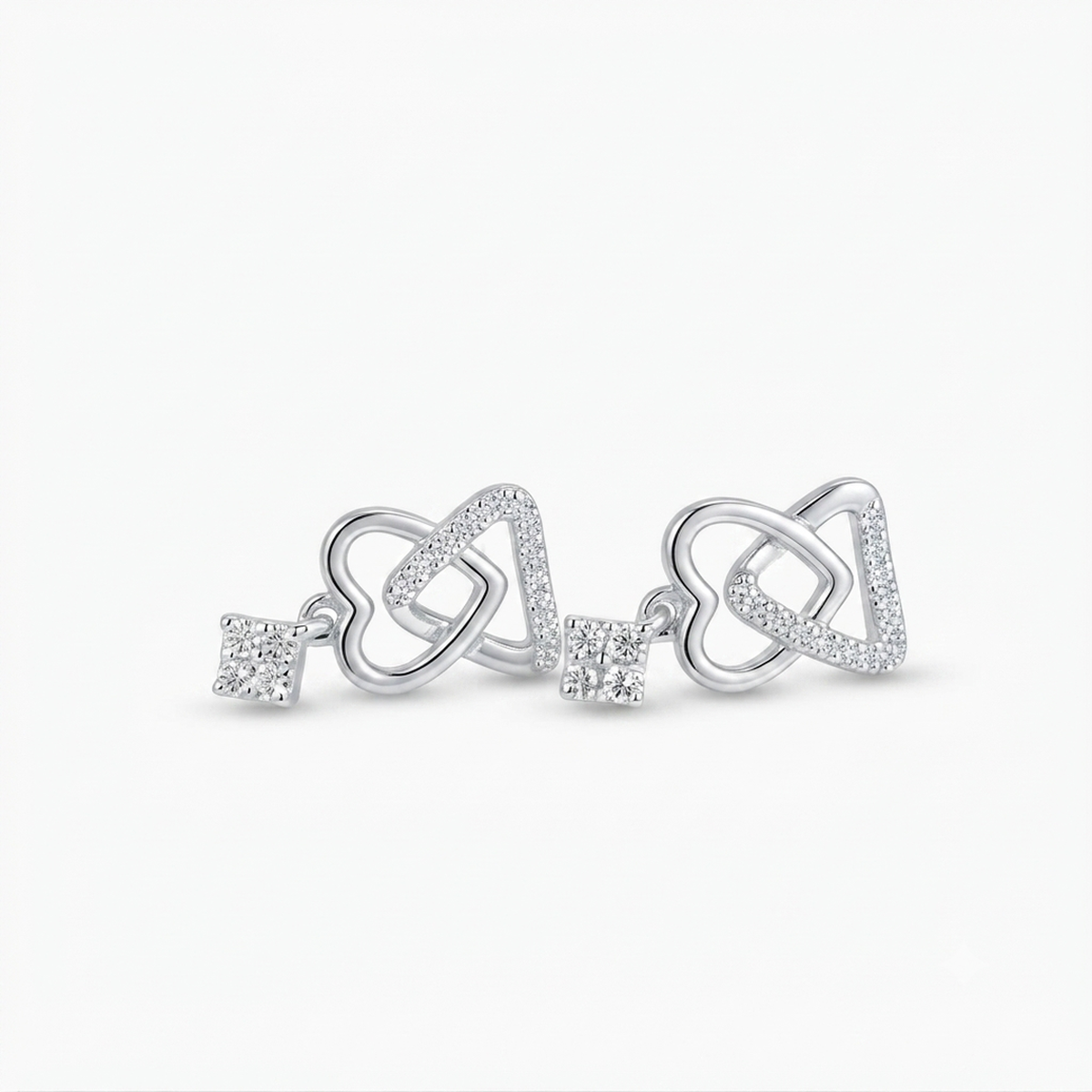 DIVYORO INTERLOCKING HEART AND KEY SILVER STUDS EARRING