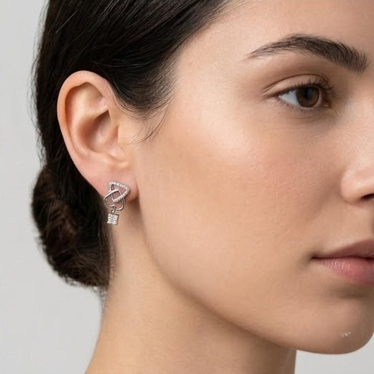 DIVYORO INTERLOCKING HEART AND KEY SILVER STUDS EARRING