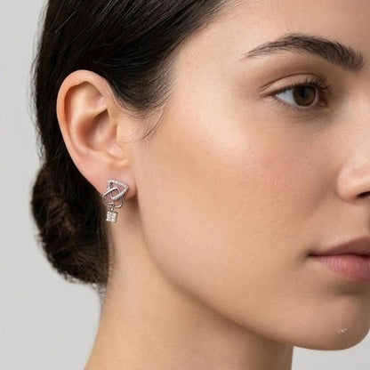 DIVYORO INTERLOCKING HEART AND KEY SILVER STUDS EARRING